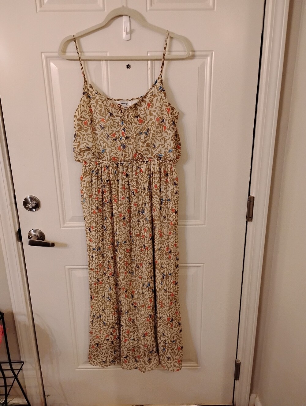 Sweet Cream Colored Floral Print Tiered Maxi Dress With Thin Shoulder Straps.